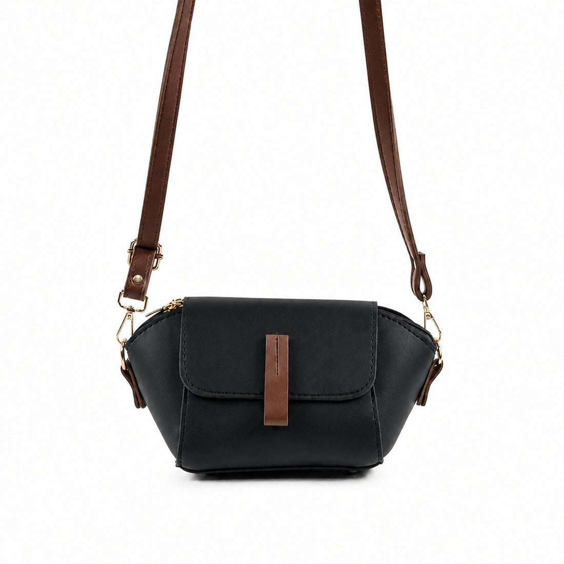 Saffiano flap crossbody bag in black - product front view on beige background with brown strap