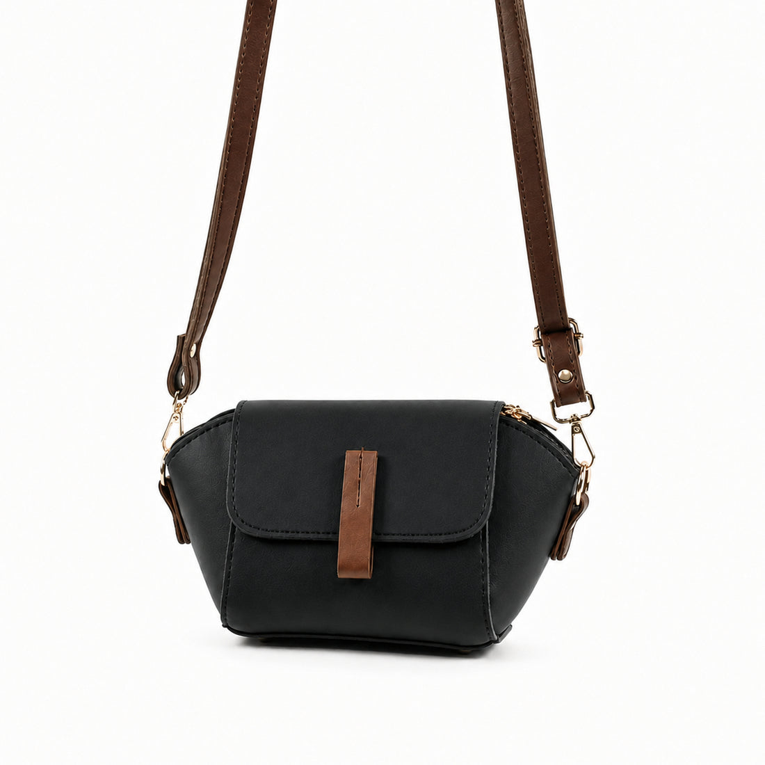 Saffiano flap crossbody bag in black - product front view on beige background with brown strap