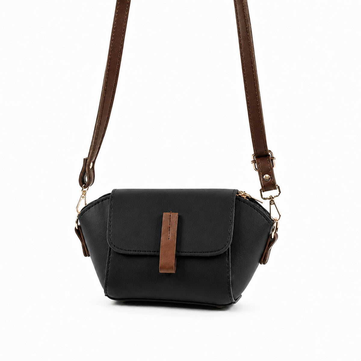 Saffiano flap crossbody bag in black - model wearing as crossbody with pink embroidered outfit back view