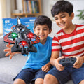 Two kids playing with S1 RC Combat Drone Fighter Plane indoors smiling