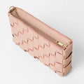 Woven leather crossbody clutch in blush pink - top open view showing gold zip closure detail
