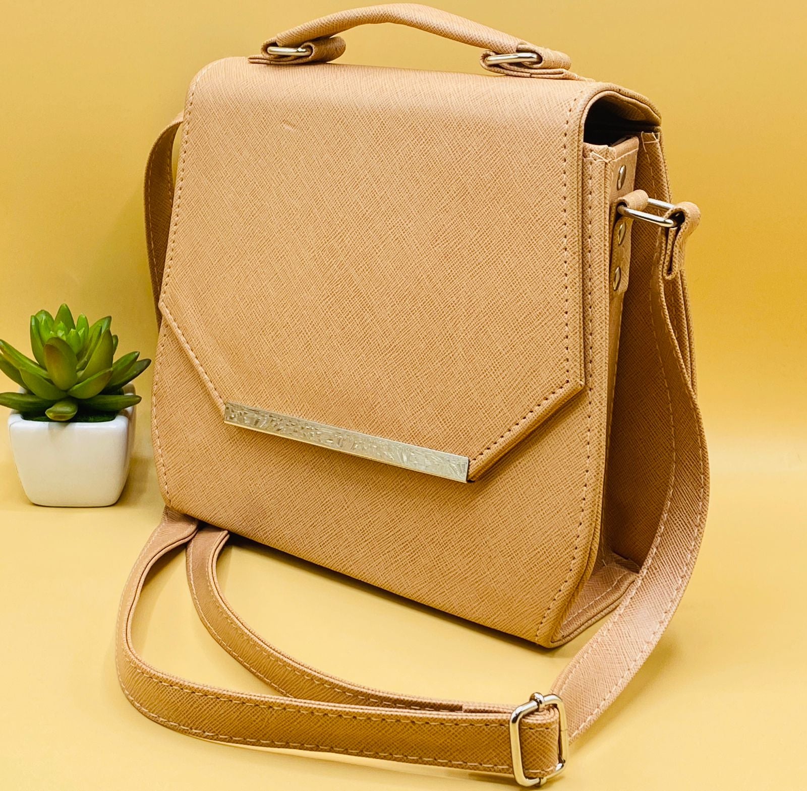 Beige saffiano crossbody satchel bag - side angle view