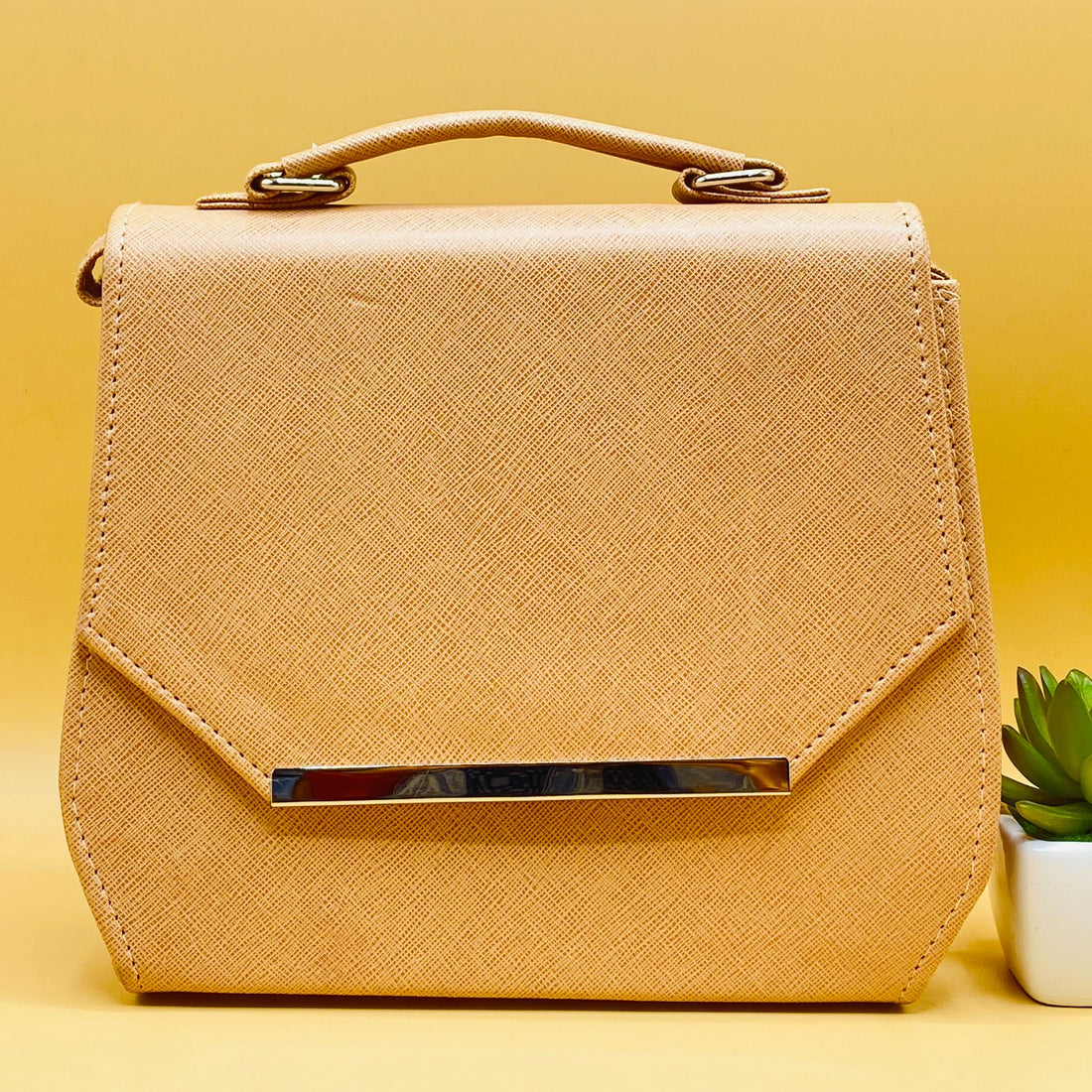 Beige saffiano crossbody satchel bag - side angle view