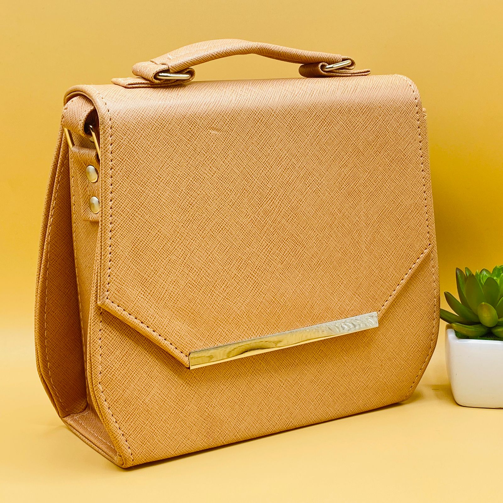 Beige saffiano crossbody satchel bag - angle view with strap
