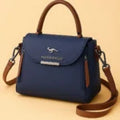 Kaidernenggo two-tone handbag in navy blue with brown trim - lifestyle thumbnail view