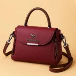 Kaidernenggo two-tone handbag in maroon/wine with brown trim - lifestyle thumbnail view