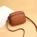 Quilted crossbody bag interior showing 3 compartments with items
