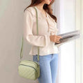 Mint green quilted crossbody bag - model side view