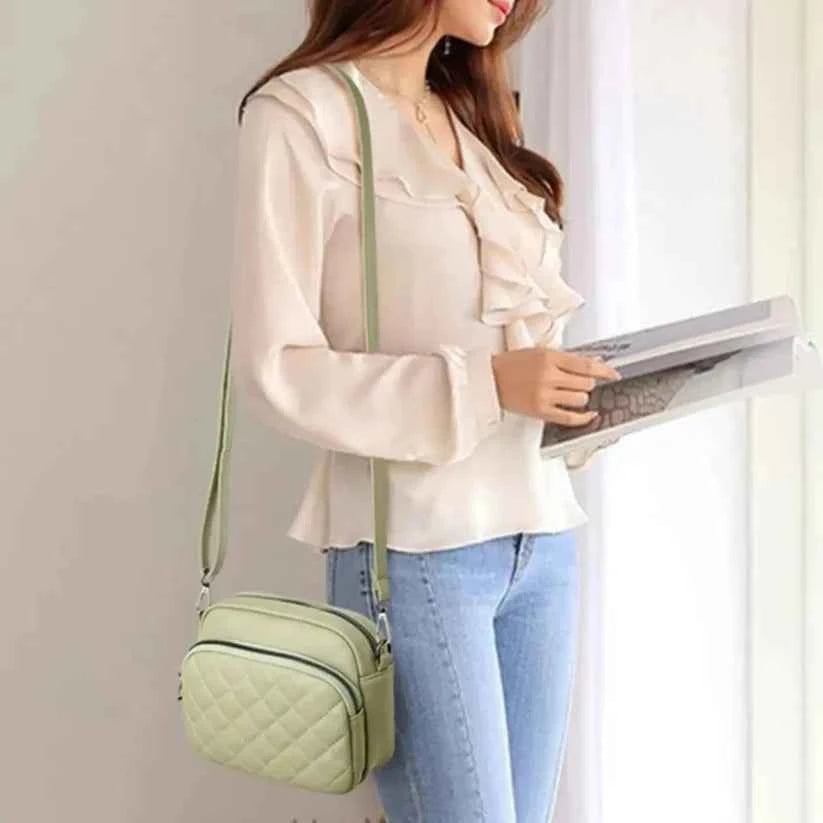 Mint green quilted crossbody bag - model side view