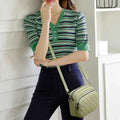 Quilted crossbody bag - angle view showing strap