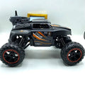 4WD RC Climbing Monster Truck side view with remote controller on white background