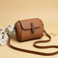 Cavelle crossbody purse in camel - angle view with strap
