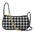 Chic houndstooth shoulder bag - product front view on white background