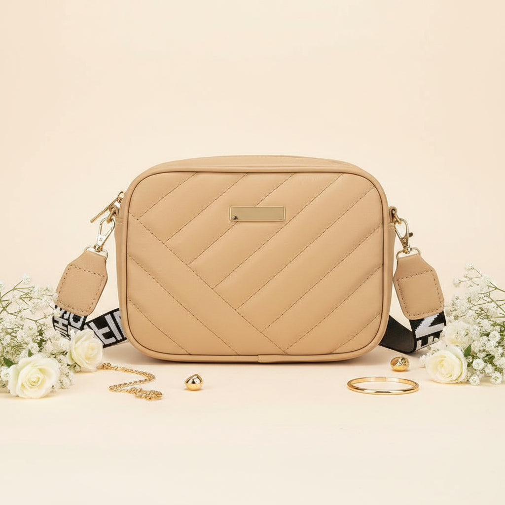 Elorina luxe crossbody bag in white - lifestyle front view with gold accessories