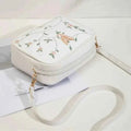 Embroidered butterfly crossbody bag in pink - front view angle 2