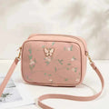 Embroidered butterfly crossbody bag - floral embroidery close-up detail