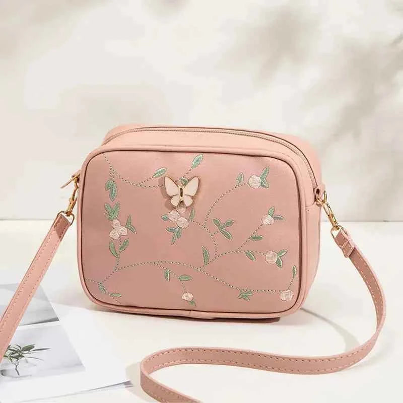 Embroidered butterfly crossbody bag - floral embroidery close-up detail