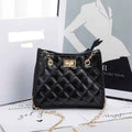 Laila mini chain satchel in black - editorial side view on fashion magazine