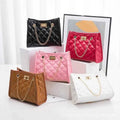 Laila mini chain satchel in black and camel - all colors flat lay