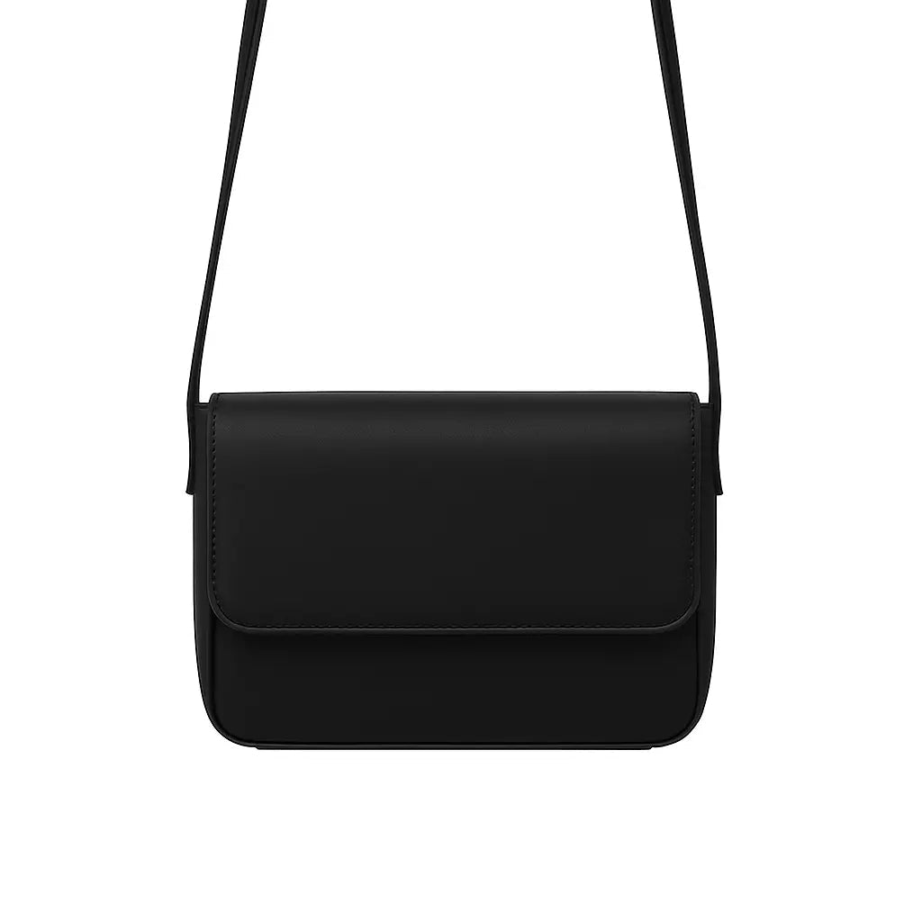 Magnetic crossbody bag in black - lifestyle front view with white flowers and gold rings