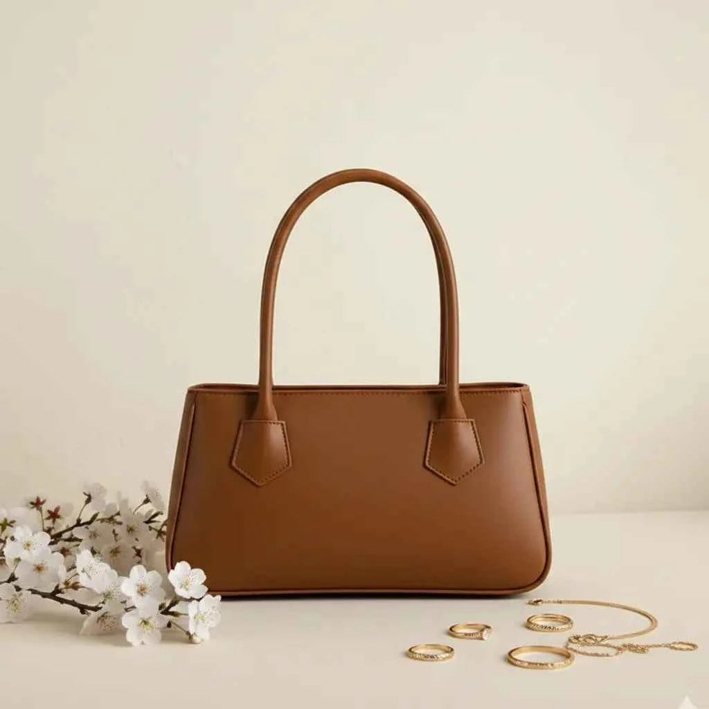 Mahveen elegant ladies handbag in camel - front view with white flowers and gold rings