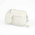 Quilted crossbody bag with coin pocket in white - side angle product view on white background
